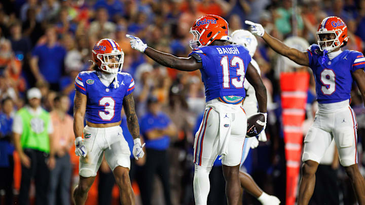 Aug 30, 2025; Gainesville, Florida, USA; Florida Gators running back Jadan Baugh (13) and Florida Gators wide receiver J. Michael Sturdivant (9) gesture after a run against the Long Island Sharks during the first half at Ben Hill Griffin Stadium. Mandatory Credit: Matt Pendleton-Imagn Images