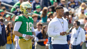 Apr 12, 2025; Notre Dame, IN, USA; Notre Dame Fighting Irish quarterback Steve Angeli (18) watches alongside head coach Marcus Freeman during the Blue-Gold game at Notre Dame Stadium. 