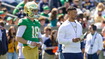 Apr 12, 2025; Notre Dame, IN, USA; Notre Dame Fighting Irish quarterback Steve Angeli (18) watches alongside head coach Marcus Freeman during the Blue-Gold game at Notre Dame Stadium. Mandatory Credit: Michael Caterina-Imagn Images