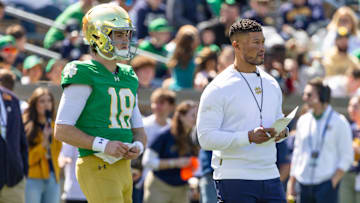 Apr 12, 2025; Notre Dame, IN, USA; Notre Dame Fighting Irish quarterback Steve Angeli (18) watches alongside head coach Marcus Freeman during the Blue-Gold game at Notre Dame Stadium. Mandatory Credit: Michael Caterina-Imagn Images