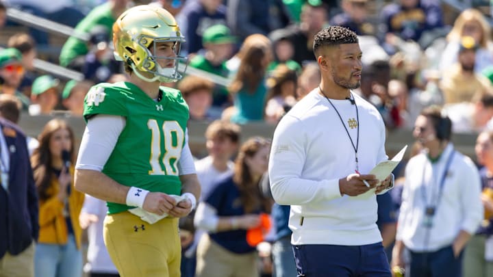 Apr 12, 2025; Notre Dame, IN, USA; Notre Dame Fighting Irish quarterback Steve Angeli (18) watches alongside head coach Marcus Freeman during the Blue-Gold game at Notre Dame Stadium. Mandatory Credit: Michael Caterina-Imagn Images