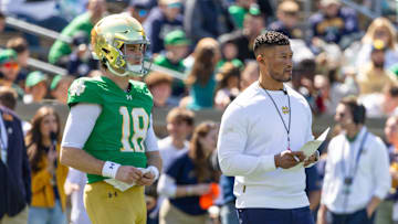 Apr 12, 2025; Notre Dame, IN, USA; Notre Dame Fighting Irish quarterback Steve Angeli (18) watches alongside head coach Marcus Freeman during the Blue-Gold game at Notre Dame Stadium. 