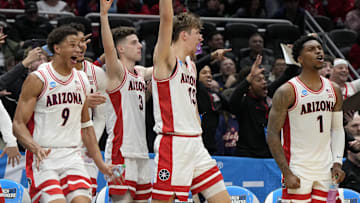 Arizona Wildcats forward Carter Bryant (9), guard Anthony Dell'Orso (3), forward Henri Veesaar (13) and guard Caleb Love (1) react on the bench against the Akron Zips during the second half in the first round of the NCAA Tournament at Climate Pledge Arena.