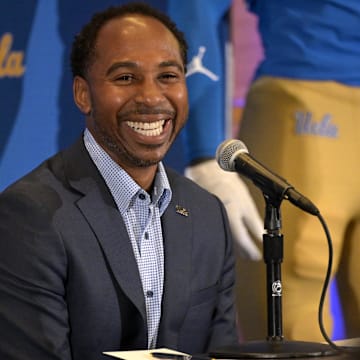 Feb 13, 2024; Los Angeles, CA, USA;  UCLA Bruins athletic director Martin Jarmond introduces DeShaun Foster as the new head football coach during a press conference at Pauley Pavilion.  Mandatory Credit: Jayne Kamin-Oncea-Imagn Images