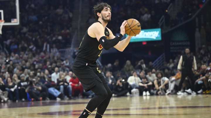 Jan 21, 2023; Cleveland, Ohio, USA; Cleveland Cavaliers forward Cedi Osman (16) shoots a three-point basket in the second quarter against the Milwaukee Bucks at Rocket Mortgage FieldHouse. Mandatory Credit: David Richard-USA TODAY Sports