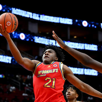 Apr 2, 2024; Houston, TX, USA; McDonald's All American West guard Karter Knox (21) shoots around McDonald's All American East forward Jayden Quaintance (21) during the second half at Toyota Center. Mandatory Credit: Maria Lysaker-USA TODAY Sports