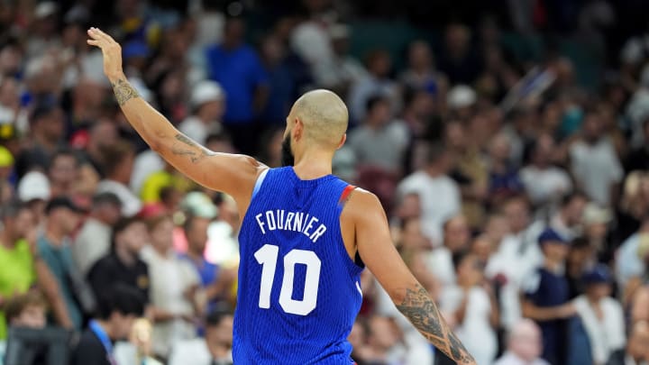 Jul 30, 2024; Villeneuve-d'Ascq, France; France shooting guard Evan Fournier (10) celebrates with the crowd after France defeated Japan in men’s basketball group B play during the Paris 2024 Olympic Summer Games at Stade Pierre-Mauroy. Mandatory Credit: John David Mercer-USA TODAY Sports