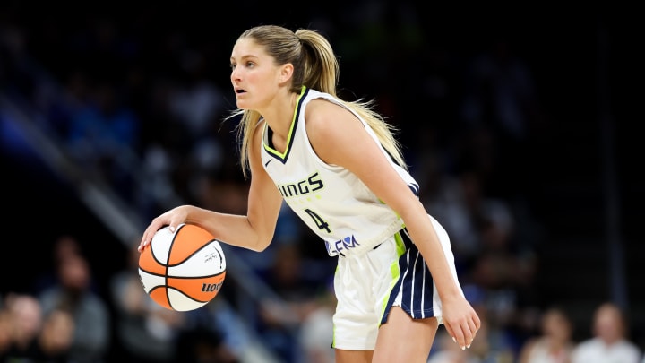 May 3, 2024; Dallas, Texas, USA; Dallas Wings guard Jacy Sheldon (4) controls the ball during the second half against the Indiana Fever at College Park Center.
