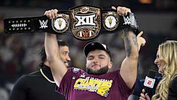 Dec 7, 2024; Arlington, TX, USA; Arizona State Sun Devils running back Cam Skattebo (4) holds up the WWE Big 12 championship belt after the Sun Devils defeat the Iowa State Cyclones and win the 2024 Big 12 Championship at AT&T Stadium. Mandatory Credit: Jerome Miron-Imagn Images