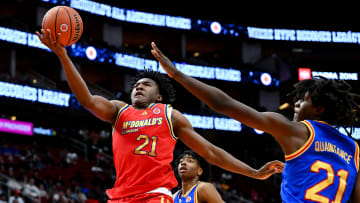 McDonald's All American West guard Karter Knox (21) shoots around McDonald's All American East forward Jayden Quaintance (21) during the second half at Toyota Center. 