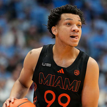 Mar 1, 2025; Chapel Hill, North Carolina, USA;  Miami (Fl) Hurricanes guard Divine Ugochukwu (99) with the ball in the first half at Dean E. Smith Center. Mandatory Credit: Bob Donnan-Imagn Images