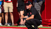 Dana Holgorsen watches during warmups before the game against the Houston Christian Huskies.