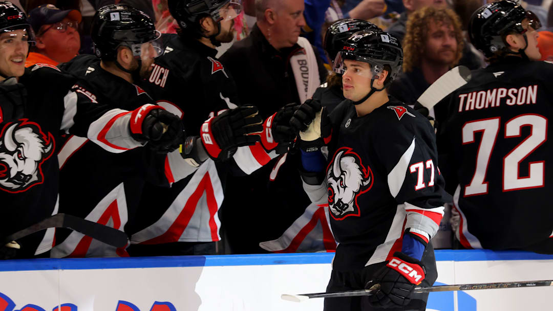 Apr 8, 2025; Buffalo, New York, USA;  Buffalo Sabres right wing JJ Peterka (77) celebrates his goal with teammates during the third period against the Carolina Hurricanes at KeyBank Center. Mandatory Credit: Timothy T. Ludwig-Imagn Images