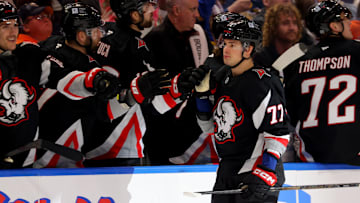 Apr 8, 2025; Buffalo, New York, USA;  Buffalo Sabres right wing JJ Peterka (77) celebrates his goal with teammates during the third period against the Carolina Hurricanes at KeyBank Center. Mandatory Credit: Timothy T. Ludwig-Imagn Images