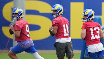 May 28, 2025; Woodland Hills, CA, USA; Los Angeles Rams quarterbacks Stetson Bennett (13)  Jimmy Garoppolo (11) and Matt Stafford (9) participate in offensive drills during organized team activities at Rams Practice Facility. Mandatory Credit: Kirby Lee-Imagn Images