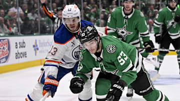 May 21, 2025; Dallas, Texas, USA; Edmonton Oilers center Mattias Janmark (13) and Dallas Stars center Wyatt Johnston (53) in action during the game between the Dallas Stars and the Edmonton Oilers in game one of the Western Conference Final of the 2025 Stanley Cup Playoffs at American Airlines Center. Mandatory Credit: Jerome Miron-Imagn Images