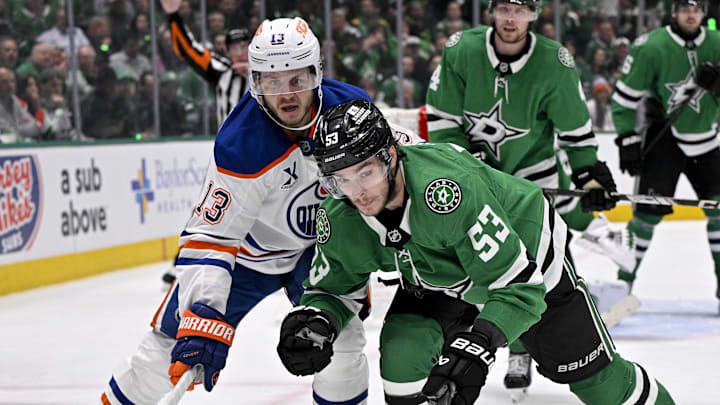 May 21, 2025; Dallas, Texas, USA; Edmonton Oilers center Mattias Janmark (13) and Dallas Stars center Wyatt Johnston (53) in action during the game between the Dallas Stars and the Edmonton Oilers in game one of the Western Conference Final of the 2025 Stanley Cup Playoffs at American Airlines Center. Mandatory Credit: Jerome Miron-Imagn Images