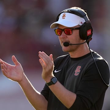Aug 30, 2025; Los Angeles, California, USA; Southern California Trojans head coach Lincoln Riley watches from the sidelines against the Missouri State Bears in the first half at United Airlines Field at Los Angeles Memorial Coliseum. Mandatory Credit: Kirby Lee-Imagn Images
