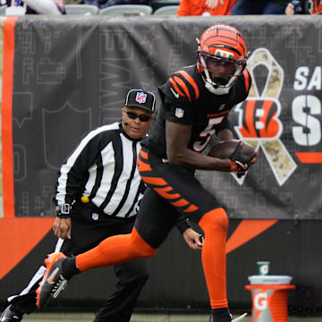 Bengals Tee Higgins (5) leaps to catch the ball and goes on to score a touchdown for the Bengals during their game against the Bears at Paycor Stadium on Sunday November 2, 2025.