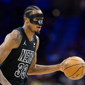 Apr 14, 2024; Philadelphia, Pennsylvania, USA; Brooklyn Nets center Nic Claxton (33) dribbles the ball against the Philadelphia 76ers during the first quarter at Wells Fargo Center. Mandatory Credit: Bill Streicher-USA TODAY Sports