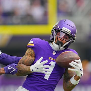 Nov 9, 2025; Minneapolis, Minnesota, USA; Minnesota Vikings wide receiver Jalen Nailor (1) catches a pass against Baltimore Ravens cornerback Marlon Humphrey (44) in the first quarter at U.S. Bank Stadium. Mandatory Credit: Brad Rempel-Imagn Images