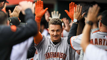 Mar 30, 2025; Cincinnati, Ohio, USA; San Francisco Giants third baseman Matt Chapman (26) high fives teammates after hitting a two-run home run in the sixth inning against the Cincinnati Reds at Great American Ball Park.