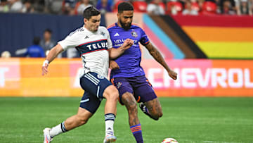 Houston Dynamo FC defender Micael dos Santos (31) and Vancouver Whitecaps FC forward Brian White (24) collide during the second half at BC Place 