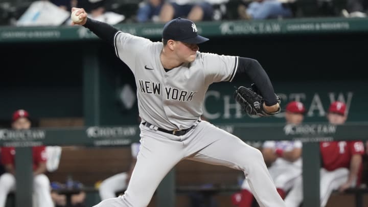 Oct 3, 2022; Arlington, Texas, USA; New York Yankees relief pitcher Scott Effross (59) delivers a pitch to the Texas Rangers during the ninth inning at Globe Life Field. The Yankees won 3-1. Mandatory Credit: Jim Cowsert-USA TODAY Sports