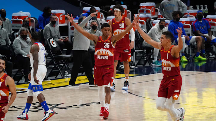 Apr 28, 2021; Denver, Colorado, USA; Denver Nuggets guard PJ Dozier (35) and forward Michael Porter Jr. (1) celebrate a score in the fourth quarter against the New Orleans Pelicans at Ball Arena. Mandatory Credit: Ron Chenoy-Imagn Images