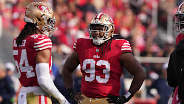 Dec 10, 2023; Santa Clara, California, USA; San Francisco 49ers defensive tackle Kalia Davis (93) stands on the field with linebacker Fred Warner (54) during the first quarter against the Seattle Seahawks at Levi's Stadium.