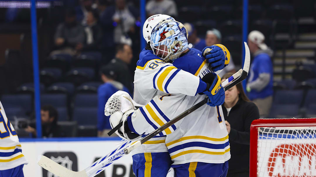 Feb 28, 2026; Tampa, Florida, USA; Buffalo Sabres forward Alex Tuch (89) and goalie Ukko-Pekka Luukkonen (1) celebrate the win over the Tampa Bay Lightning after the game at Benchmark International Arena. Mandatory Credit: Morgan Tencza-Imagn Images