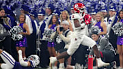 Rutgers running back Antwan Raymond (21) breaks a tackle on Kansas State cornerback Keenan Garber (1) on his way to a touchdown during first half of the Rate Bowl at Chase Field on Dec. 26, 2024, in Phoenix.