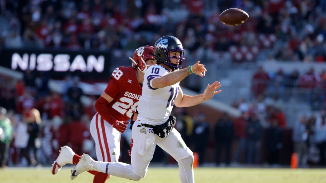 TCU Horned Frogs quarterback Josh Hoover (10) throws a pass as Oklahoma Sooners linebacker Danny Stutsman (28) pursues him during a college football game between the University of Oklahoma Sooners (OU) and the TCU Horned Frogs at Gaylord Family-Oklahoma Memorial Stadium in Norman, Okla., Friday, Nov. 24, 2023. Oklahoma won 69-45.