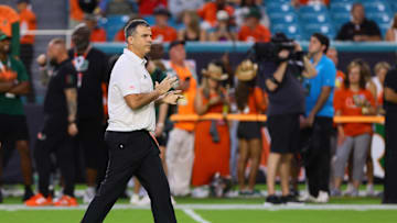 Oct 26, 2024; Miami Gardens, Florida, USA; Miami Hurricanes head coach Mario Cristobal reacts on the field before the game against the Florida State Seminoles at Hard Rock Stadium. Mandatory Credit: Sam Navarro-Imagn Images