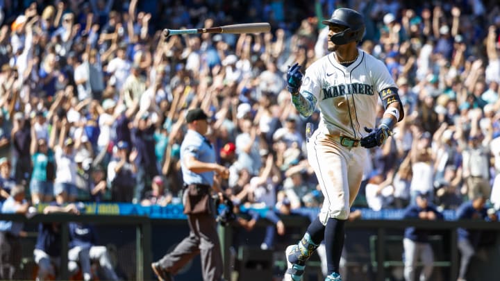 Seattle Mariners center fielder Julio Rodriguez flips his bat after hitting a two-run home run against the Tampa Bay Rays on Wednesday at T-Mobile Park.