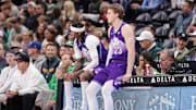 Mar 17, 2025; Salt Lake City, Utah, USA;  Utah Jazz guard Jordan Clarkson (00) and forward Lauri Markkanen (23) sit not he scorers table during the second quarter against the Chicago Bulls at Delta Center. Mandatory Credit: Chris Nicoll-Imagn Images