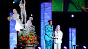 Women's Basketball Hall of Fame Inductee, Sylvia Fowles, receives the Berenson Trophy from Kristen Hughes, Smith College Athletic Director, during the 2025 Women’s Basketball Hall of Fame Induction Ceremony at the Tennessee Theatre, June 14, 2025, in Knoxville, Tenn. (Shawn Millsaps/Special to News Sentinel)
