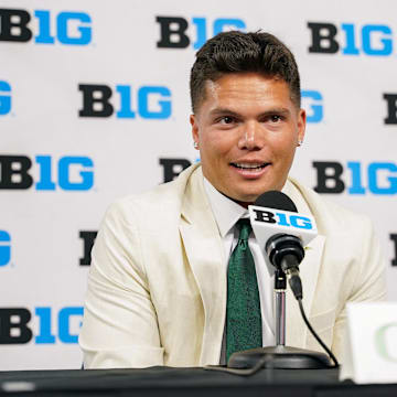 Jul 25, 2024; Indianapolis, IN, USA; Oregon Ducks quarterback Dillon Gabriel speaks to the media during the Big 10 football media day at Lucas Oil Stadium. Mandatory Credit: Robert Goddin-Imagn Images