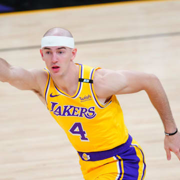 May 25, 2021; Phoenix, Arizona, USA; Los Angeles Lakers guard Alex Caruso (4) reacts against the Phoenix Suns during game two of the first round of the 2021 NBA Playoffs at Phoenix Suns Arena. Mandatory Credit: Mark J. Rebilas-Imagn Images