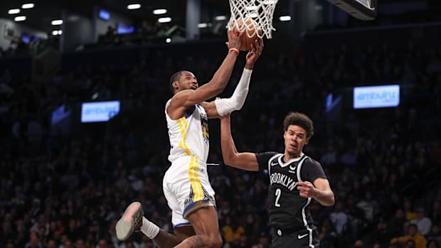 Golden State Warriors forward Jonathan Kuminga and Brooklyn Nets forward Cameron Johnso