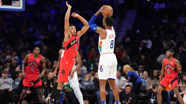 Feb 11, 2025; Philadelphia, Pennsylvania, USA; Philadelphia 76ers forward Paul George (8) shoots the ball against Toronto Raptors forward Scottie Barnes (4) in the third quarter at Wells Fargo Center. Mandatory Credit: Kyle Ross-Imagn Images