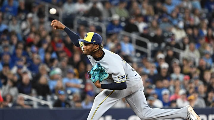 Aug 29, 2025; Toronto, Ontario, CAN;  Milwaukee Brewers relief pitcher Abner Uribe (45) delivers a pitch against the Toronto Blue Jays in the ninth inning at Rogers Centre. Mandatory Credit: Dan Hamilton-Imagn Images