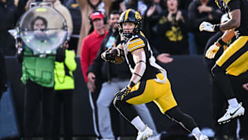 Nov 22, 2025; Iowa City, Iowa, USA; Iowa Hawkeyes wide receiver Kaden Wetjen (21) scores a touchdown on a punt return against the Michigan State Spartans during the second quarter at Kinnick Stadium. Mandatory Credit: Jeffrey Becker-Imagn Images