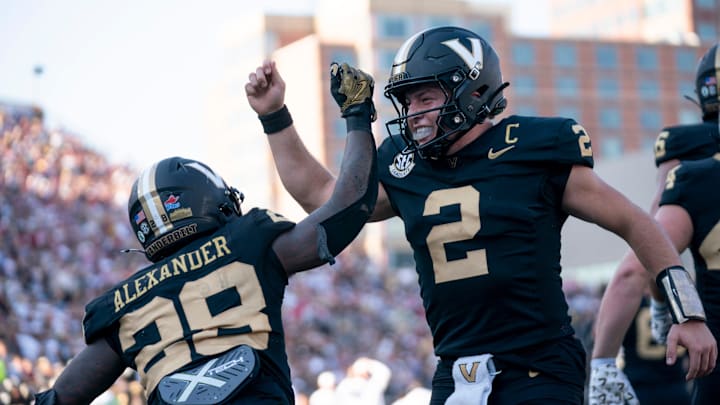 Vanderbilt Commodores running back Sedrick Alexander (28) and quarterback Diego Pavia (2)celebrate a touchdown in the end zone against the Alabama Crimson Tide during their game at Vanderbilt Stadium in Nashville, Tenn., Saturday, Oct. 5, 2024.