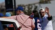 Nov 3, 2023; Arlington, TX, USA; Texas Rangers starting pitcher Jordan Montgomery (52) waves to fans during the World Series championship parade at Globe Life Field.  