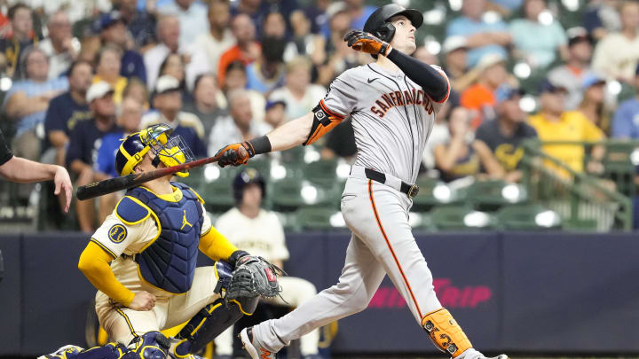 Aug 27, 2024; Milwaukee, Wisconsin, USA;  San Francisco Giants right fielder Mike Yastrzemski (5) hits a home run during the seventh inning against the Milwaukee Brewers at American Family Field.