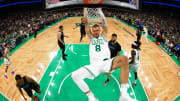 Boston Celtics center Kristaps Porzingis (8) dunks the ball.