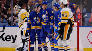 Sep 21, 2024; Buffalo, New York, USA;  Buffalo Sabres center Dylan Cozens (24) celebrates his goal with teammates during the third period against the Pittsburgh Penguins at KeyBank Center. Mandatory Credit: Timothy T. Ludwig-Imagn Images