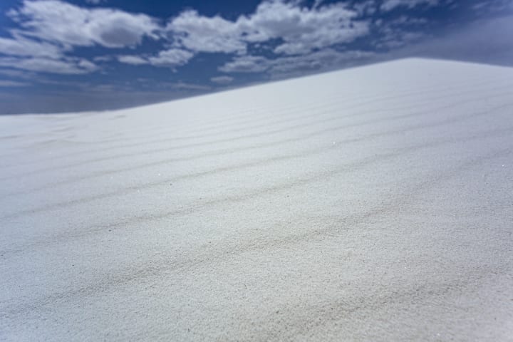 A white gypsum sand dune in White Sands National Park.