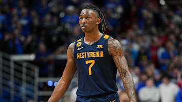 Dec 31, 2024; Lawrence, Kansas, USA; West Virginia Mountaineers guard Javon Small (7) reacts during the second half against the Kansas Jayhawks at Allen Fieldhouse. Mandatory Credit: Jay Biggerstaff-Imagn Images
